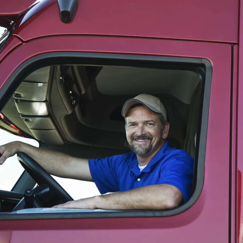 A driver at the wheel of his tractor