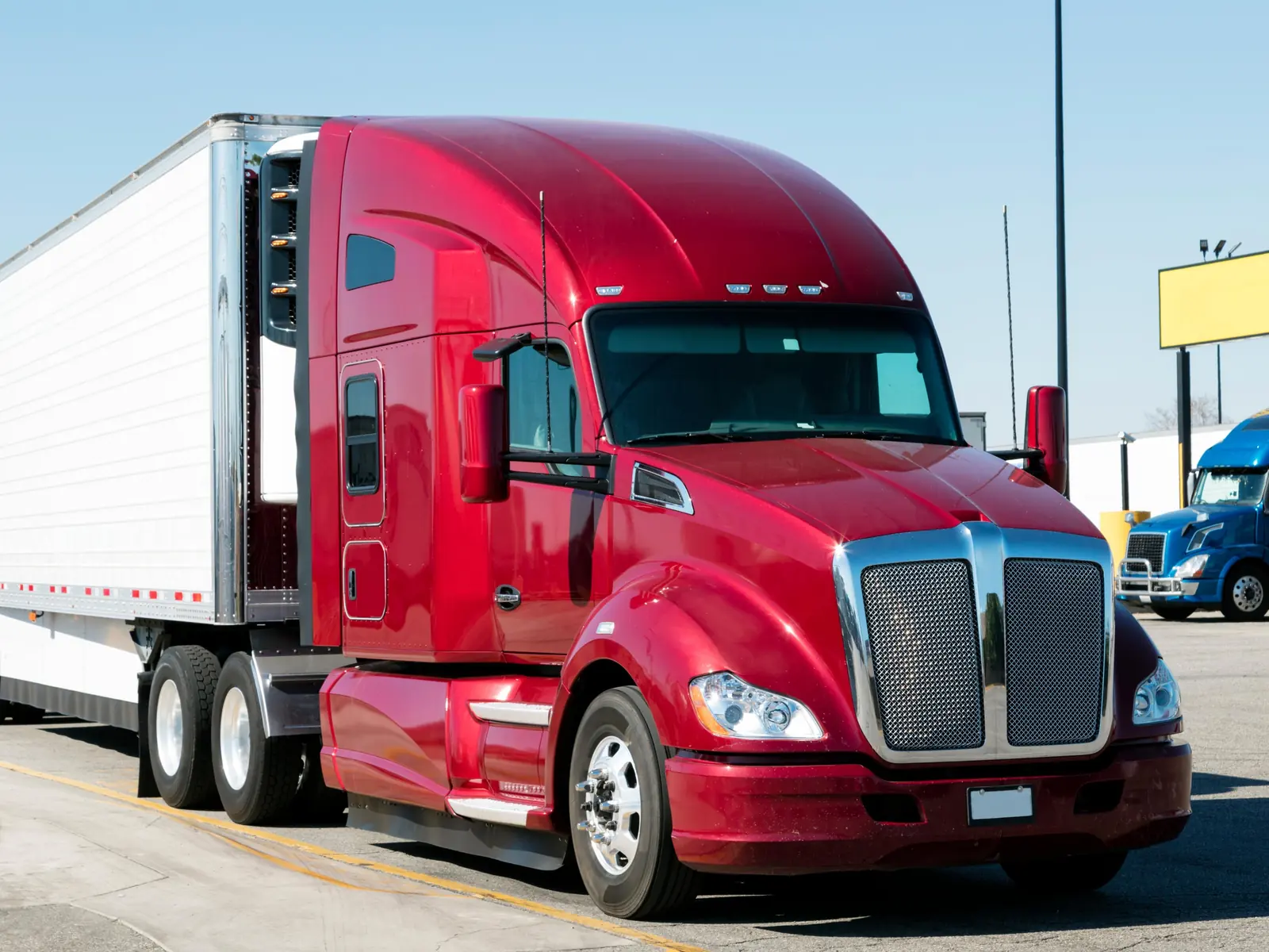 A tractor unit parked at a truck stop, ready to take a trailer
